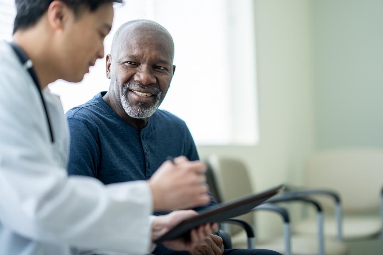 Doctor consulting with patient about clinical trial